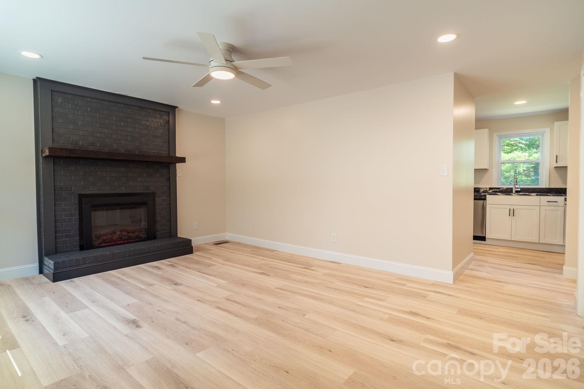Living room to kitchen - 3078 Pax Hill Road, Morganton