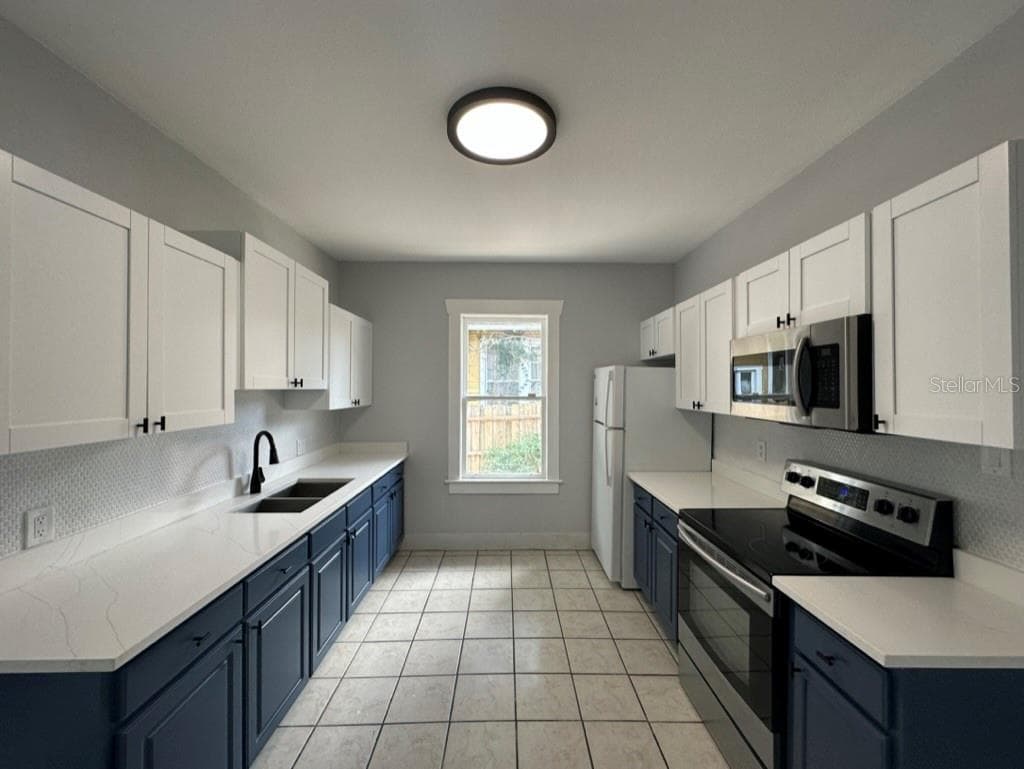 Triplex at 1021 E CAYUGA ST, TAMPA, photo 10 of 39