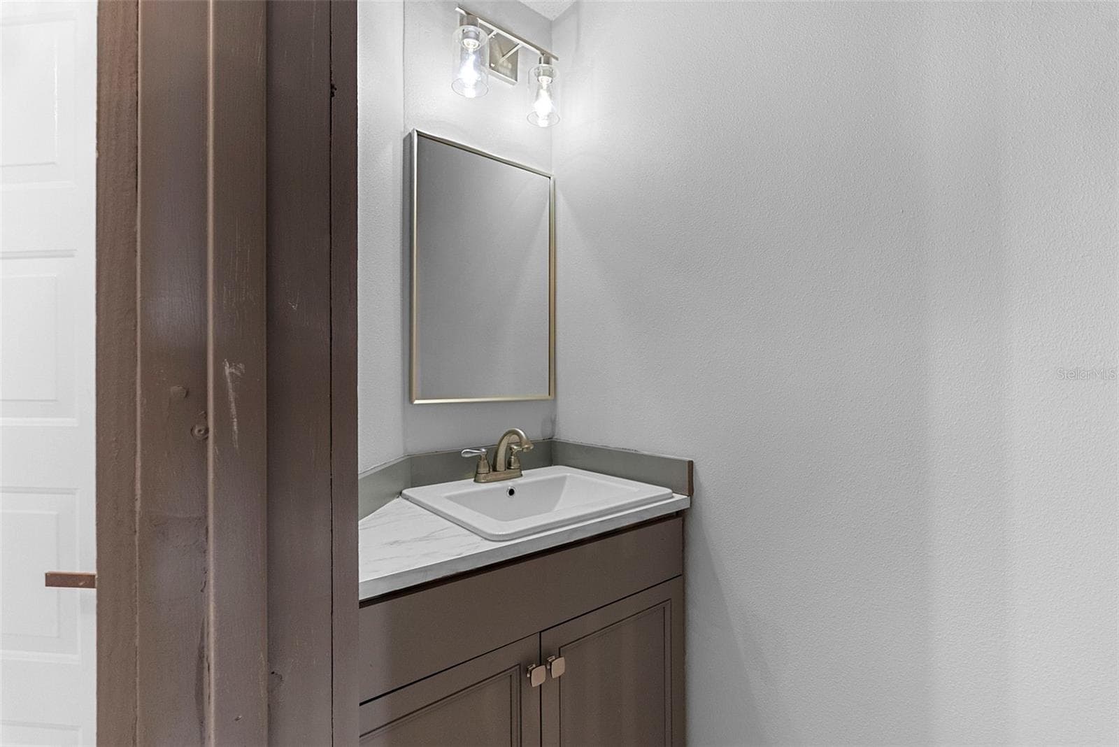 Half Bath Downstairs with Sink and Toilet - 1156 N FAIRWAY DR #1156, APOPKA
