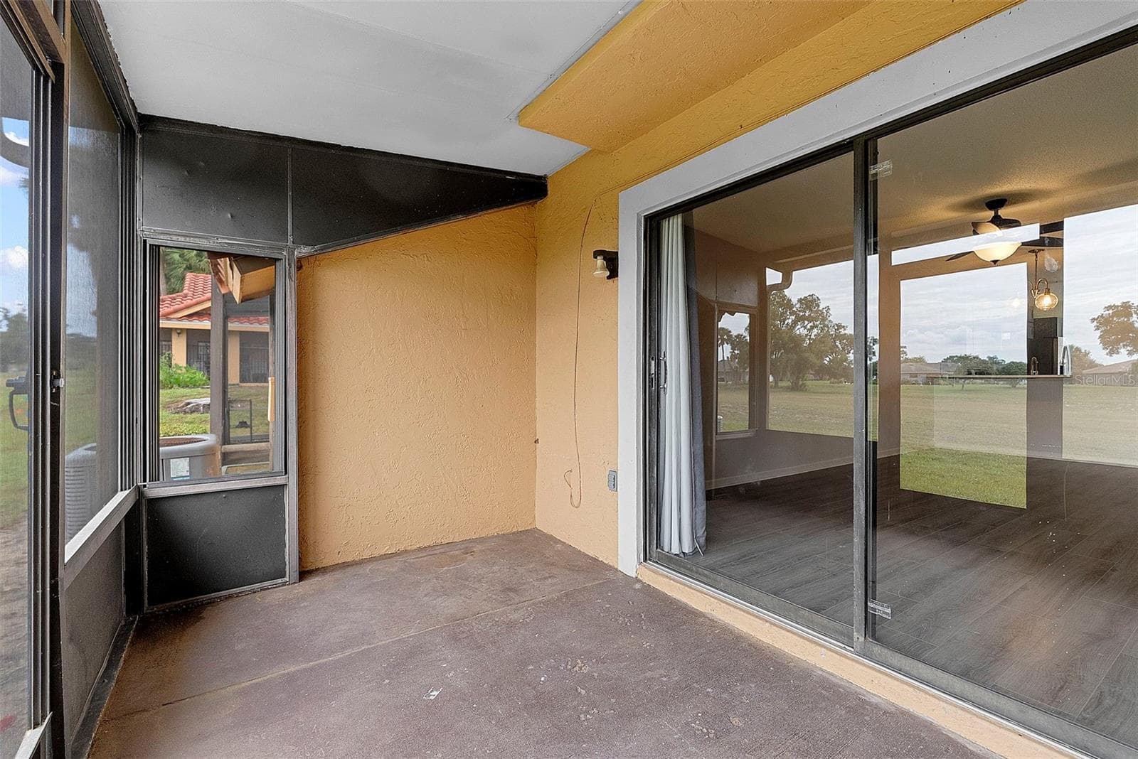 Sliding glass doors from living room to porch - 1156 N FAIRWAY DR #1156, APOPKA
