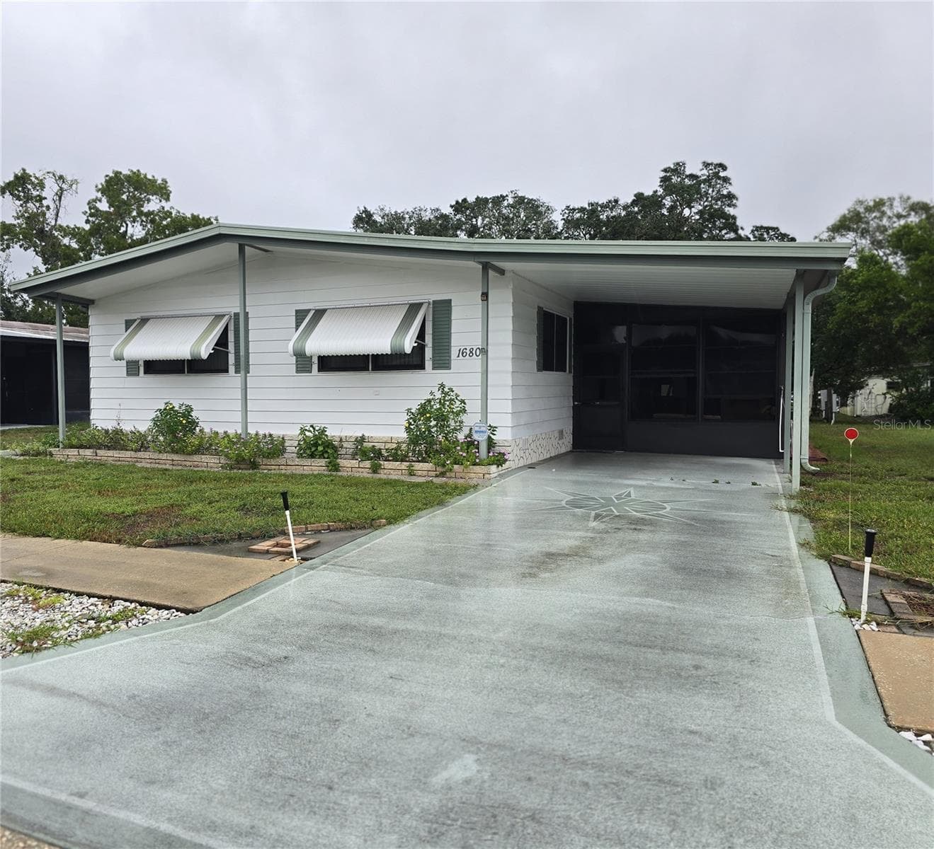 VIEW OF CARPORT & FRONT EXTERIOR - 16802 HARLEY ST, HUDSON