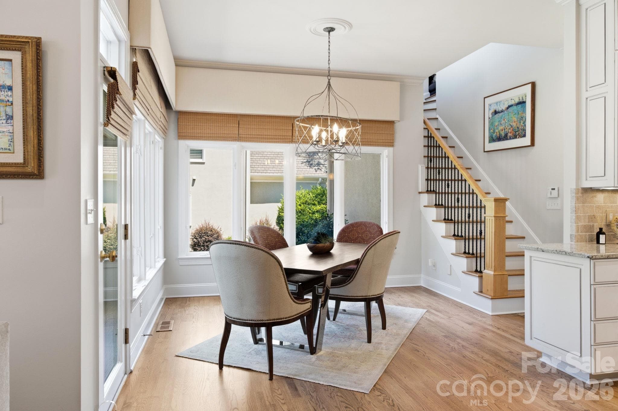 A cozy breakfast nook bathed in natural light, perfect for casual morning coffee. - 18416 Peninsula Club Drive, Cornelius