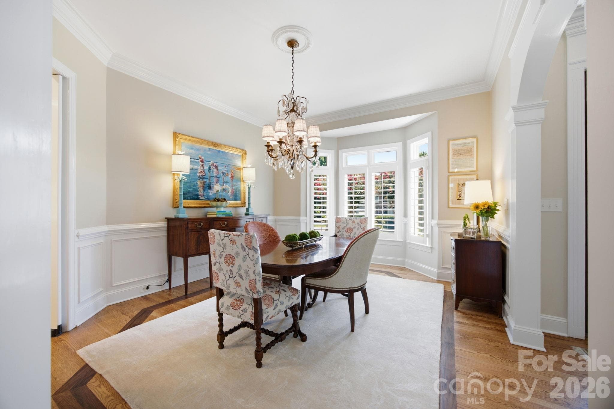 An elegant formal dining room tailored for hosting memorable dinner parties and holiday gatherings. - 18416 Peninsula Club Drive, Cornelius