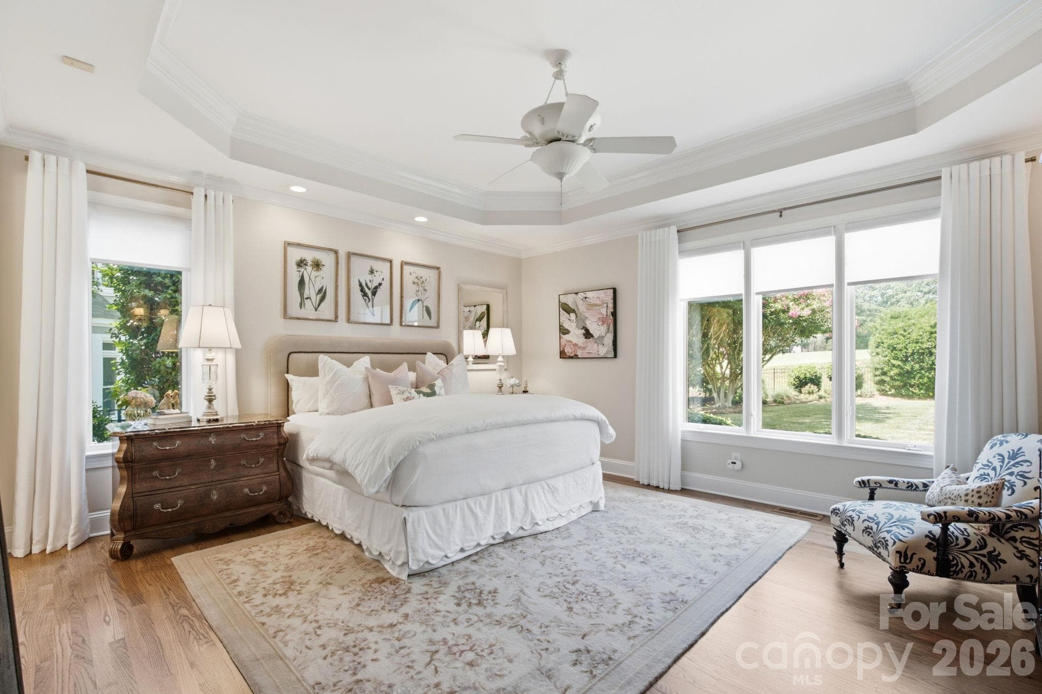 A plush, sun-drenched bedroom oasis designed for sweet dreams. - 18416 Peninsula Club Drive, Cornelius