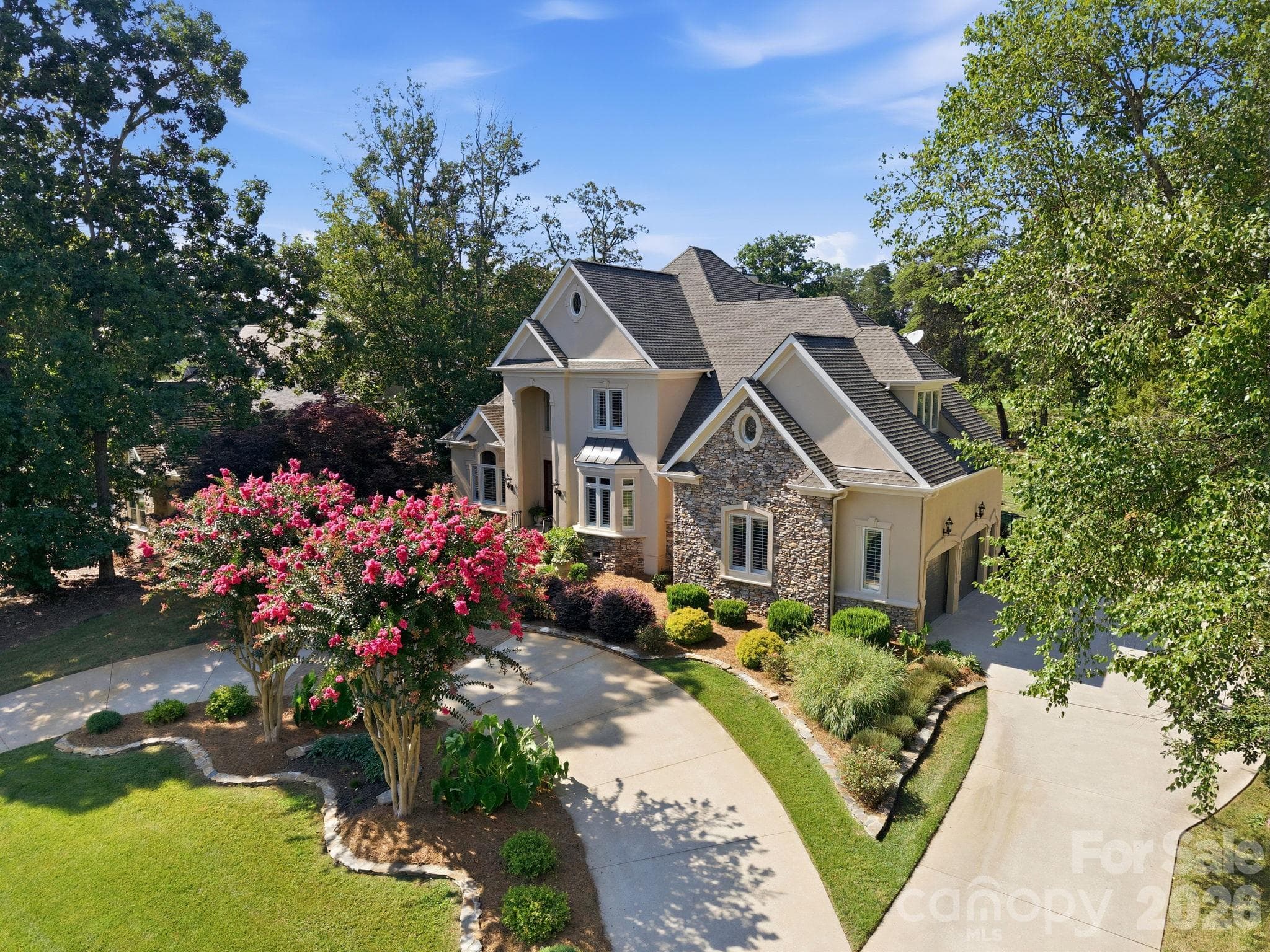 Inviting front approach showcasing your charming entryway and curb appeal. - 18416 Peninsula Club Drive, Cornelius