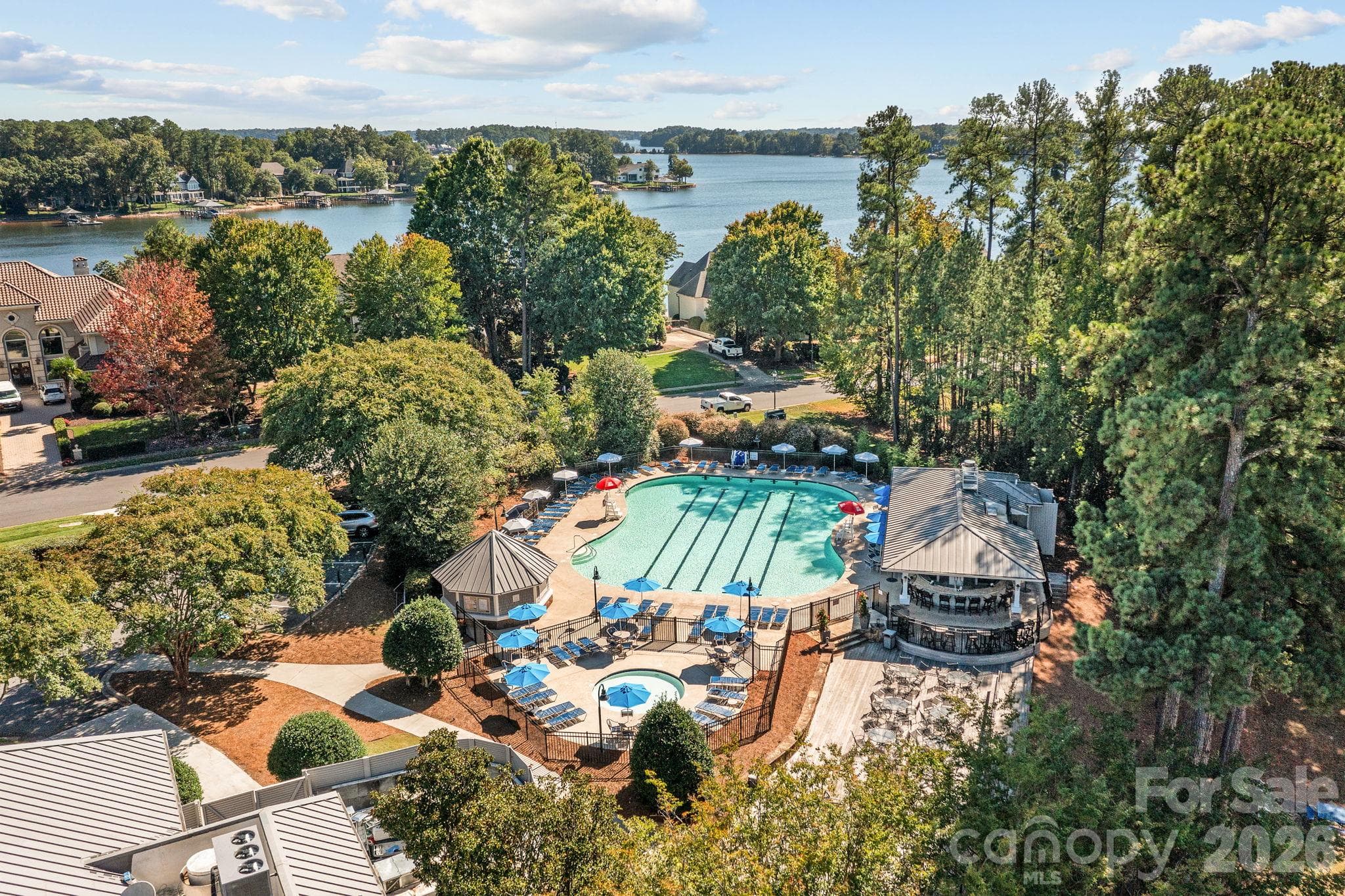 Spend warm days relaxing by the sparkling community pool. - 18416 Peninsula Club Drive, Cornelius