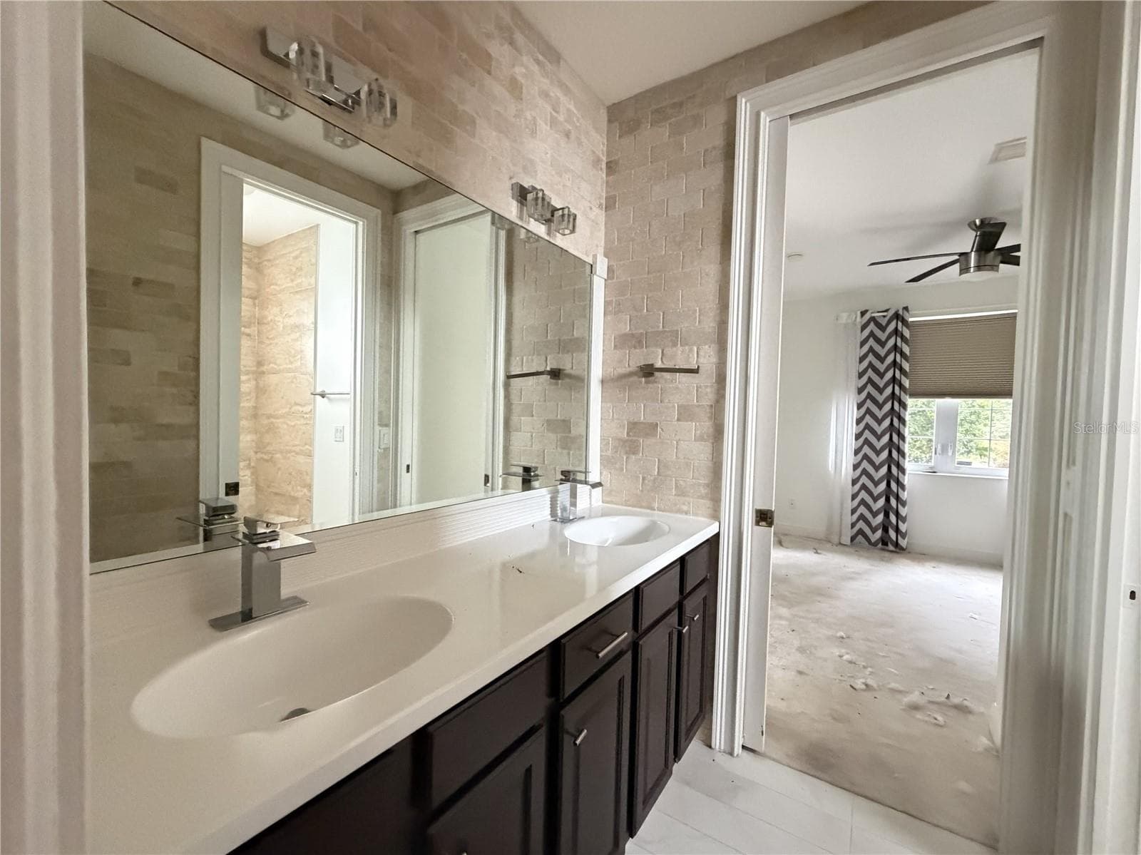Second full bathroom with dual sinks and extended vanity. - 39539 HARBOR HILLS BLVD, LADY LAKE