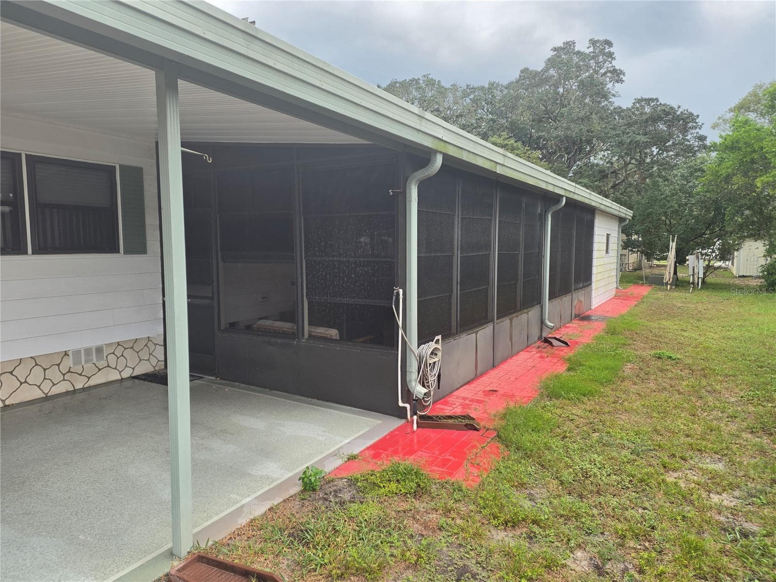 CARPORT & LANAI - 16802 HARLEY ST, HUDSON
