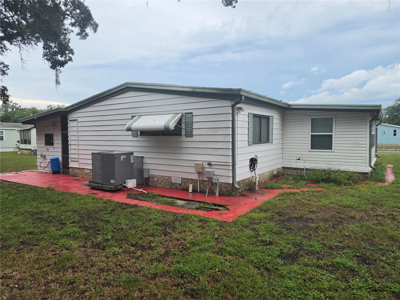 EXTERIOR SIDE OF HOME - 16802 HARLEY ST, HUDSON