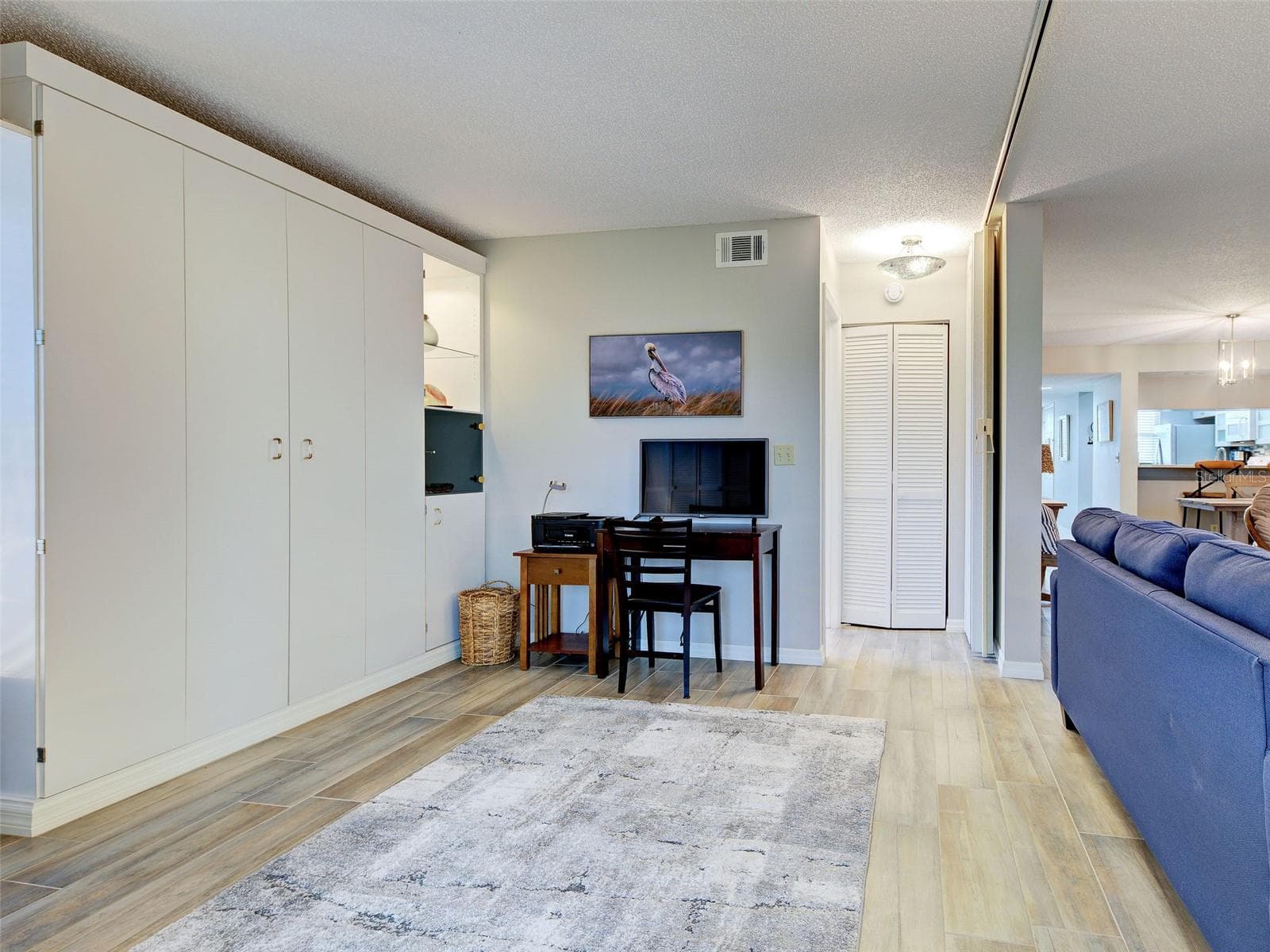 The versatility in this condo is great!  Use this space and have a larger living room or pull the foldable wall out and it creates a guest ensuite complete with its own bathroom - 435 CERROMAR LN #329, VENICE
