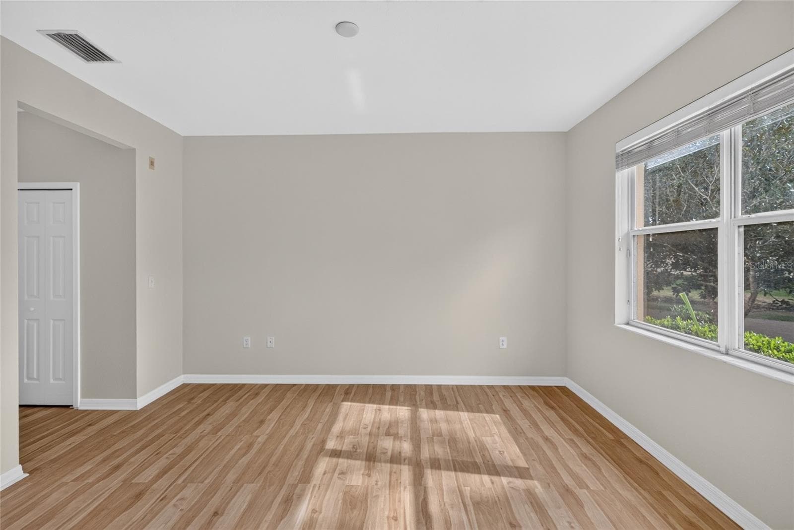 Primary bedroom with pond view - 3707 PARKRIDGE CIR #7-106, SARASOTA