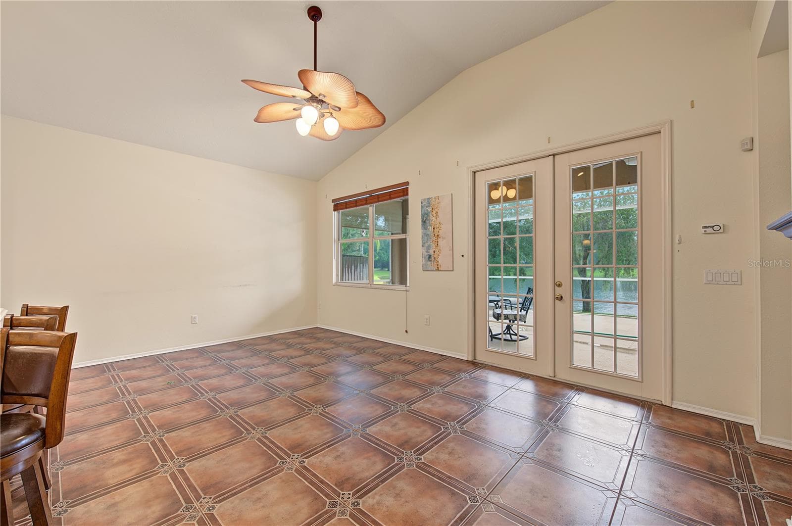 Family room with all views pointing to the pond through the french doors. - 8417 FENWICK AVE, TAMPA