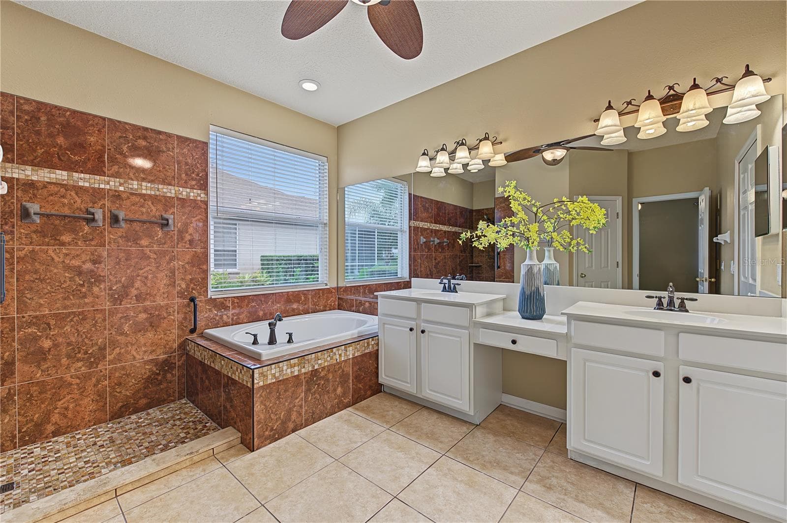 Master Bathroom, separate tub and shower, double vanities and a ceiling fan. - 8417 FENWICK AVE, TAMPA