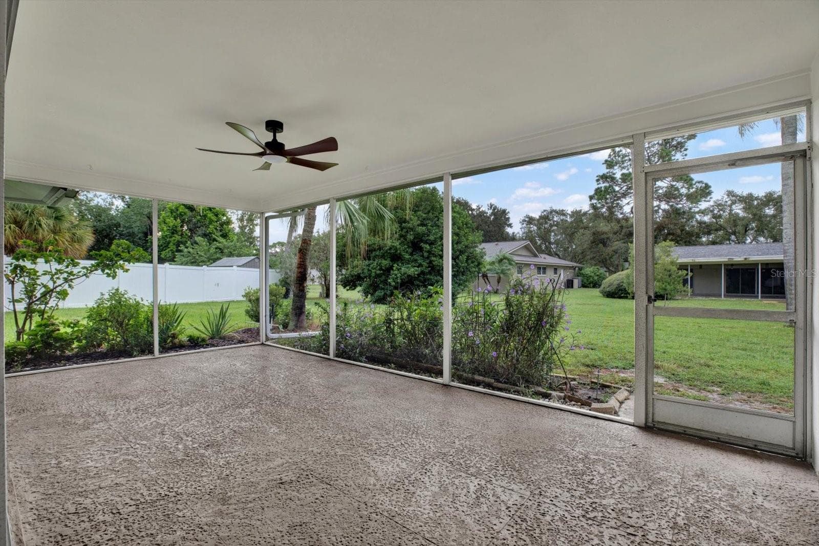 Screened-in patio - 2661 PEBBLE BEACH DR, CLEARWATER