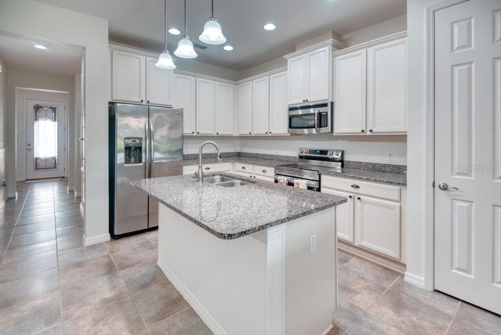 Foyer & Kitchen View - 3432 FALLBROOK DR, POINCIANA