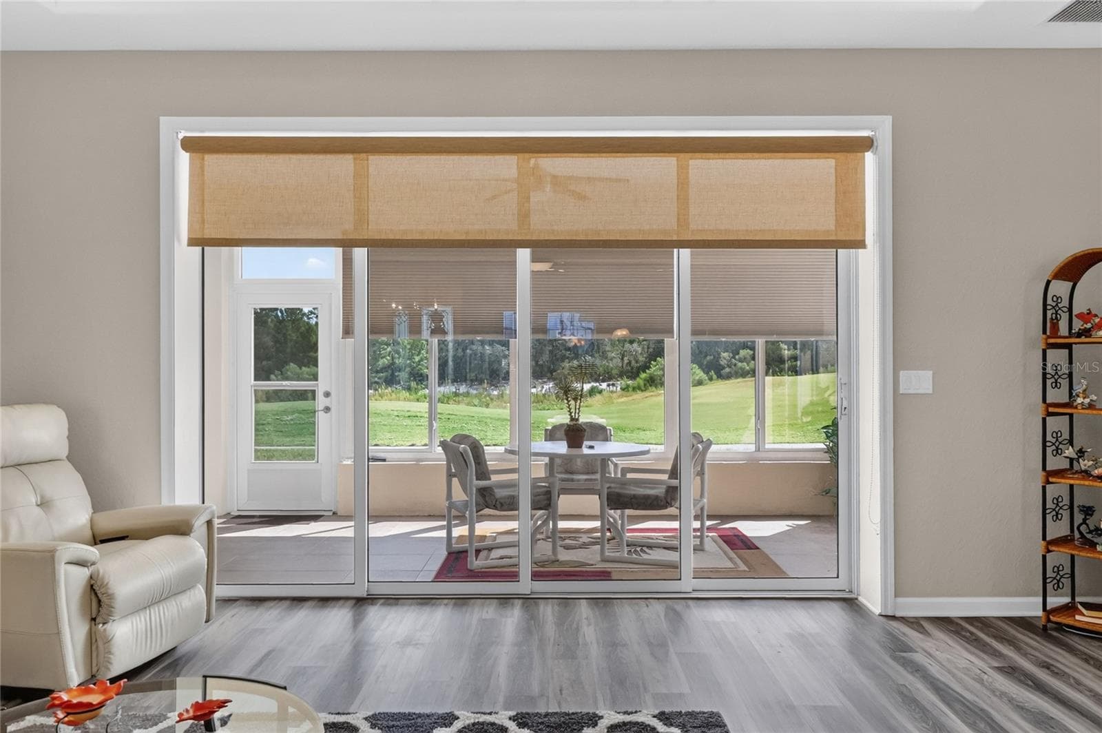 Wall of Sliding Glass Doors onto Enclosed Lanai - 4286 NORTH COURSE LN, AVON PARK