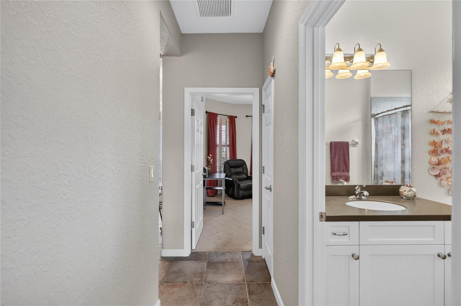 Hall to Guest Bedrooms - 4286 NORTH COURSE LN, AVON PARK