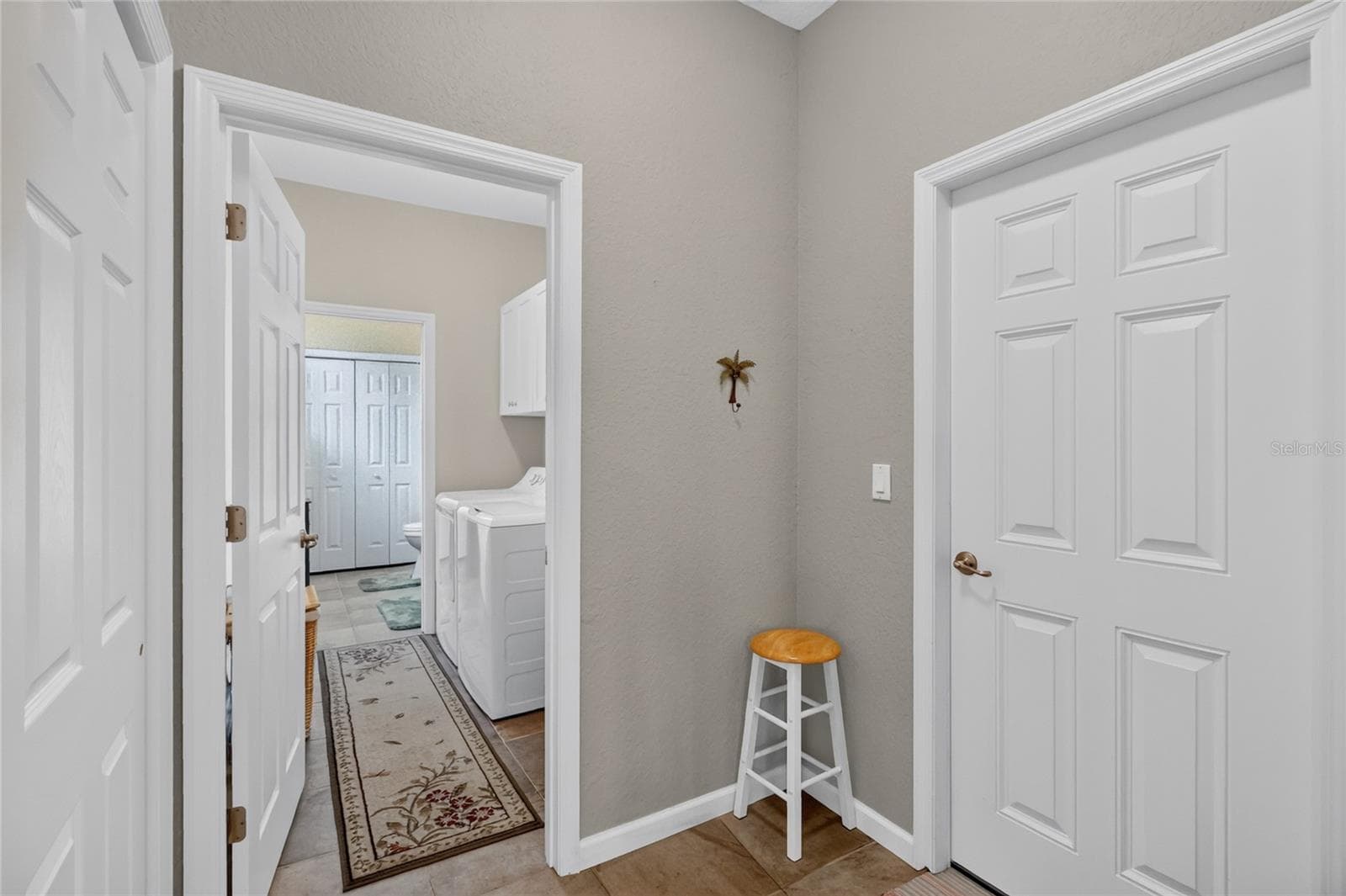 Garage door and Laundry Room - 4286 NORTH COURSE LN, AVON PARK