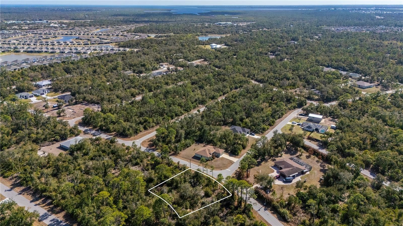 View of the oversized lot and to the Southeast is the new communities of West Port. - 1216 SHERWIN ST, PORT CHARLOTTE