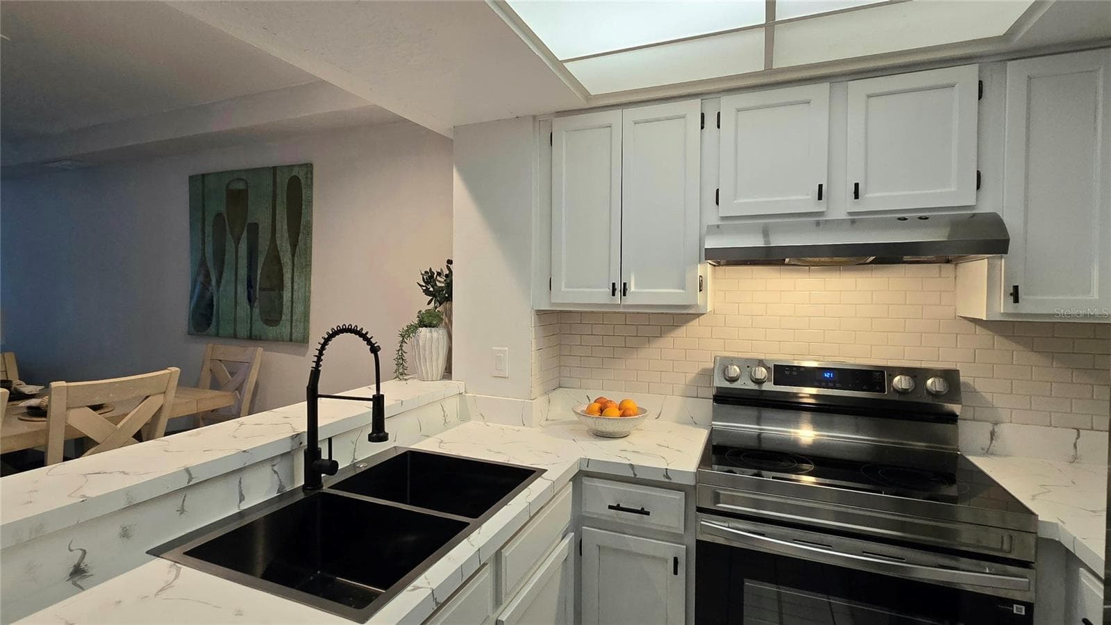 Open kitchen with Breakfast Bar. - 19201 VISTA LN #D2, INDIAN SHORES
