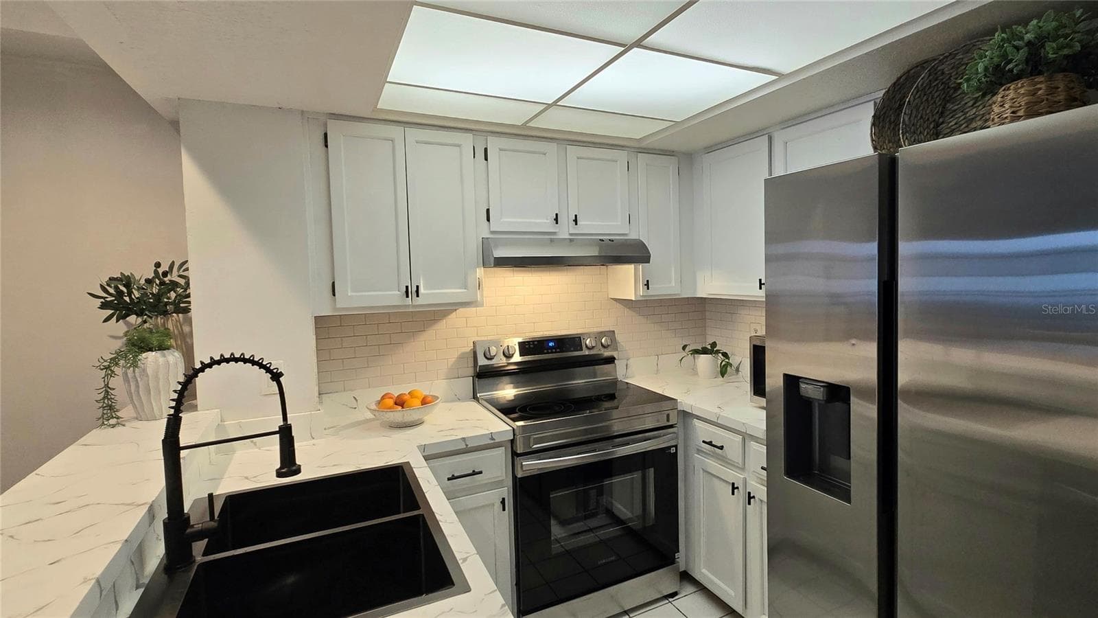 There is a walk-in pantry in addition to the kitchen cabinets for more storage. - 19201 VISTA LN #D2, INDIAN SHORES