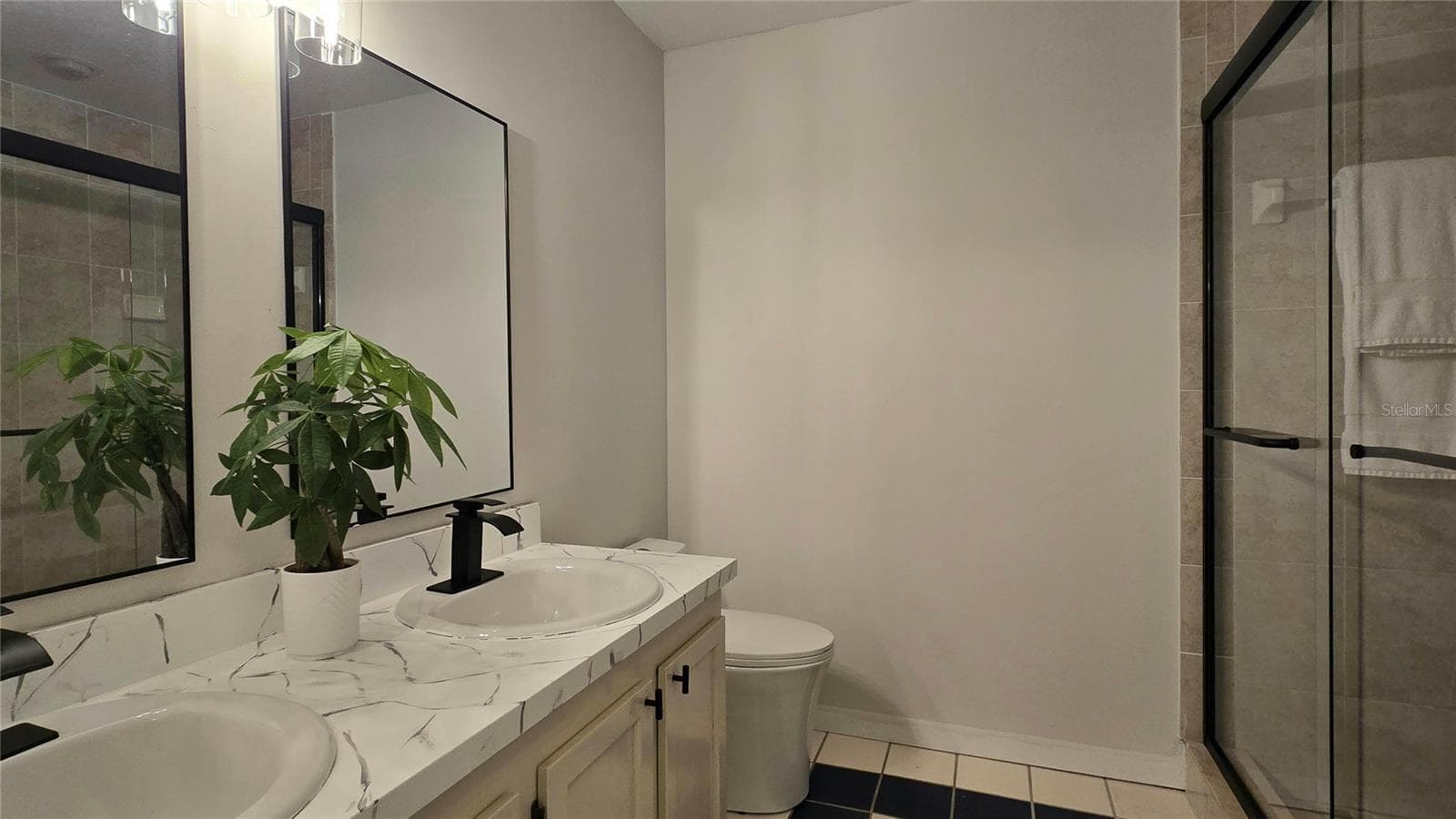 Primary Ensuite Bath with Double Vanity and Shower with new glass doors. - 19201 VISTA LN #D2, INDIAN SHORES
