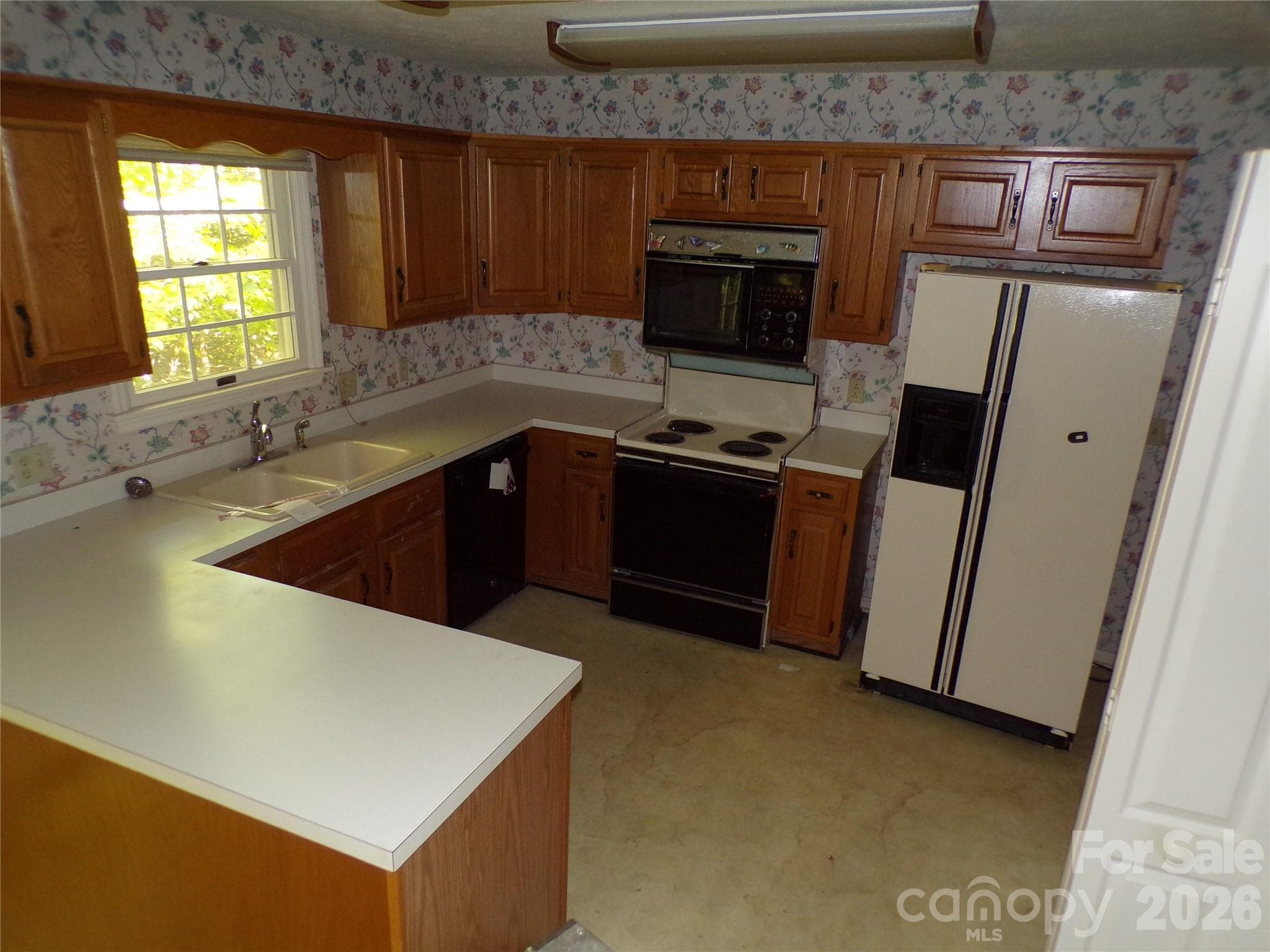 Kitchen located on right side of the main living room - 10 Governors Drive, Hendersonville