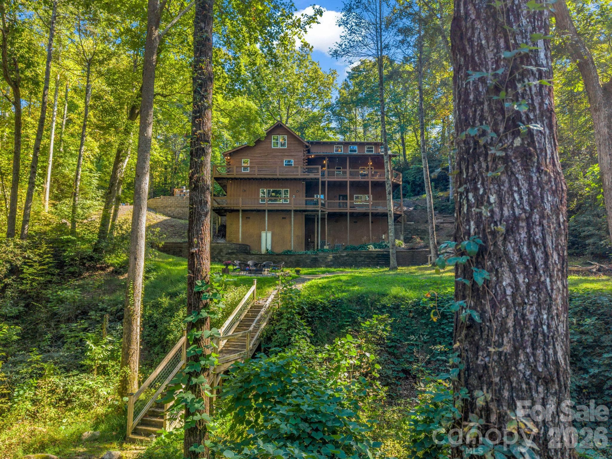 Back of house with stairs - 127 Cattail Road, Lake Lure