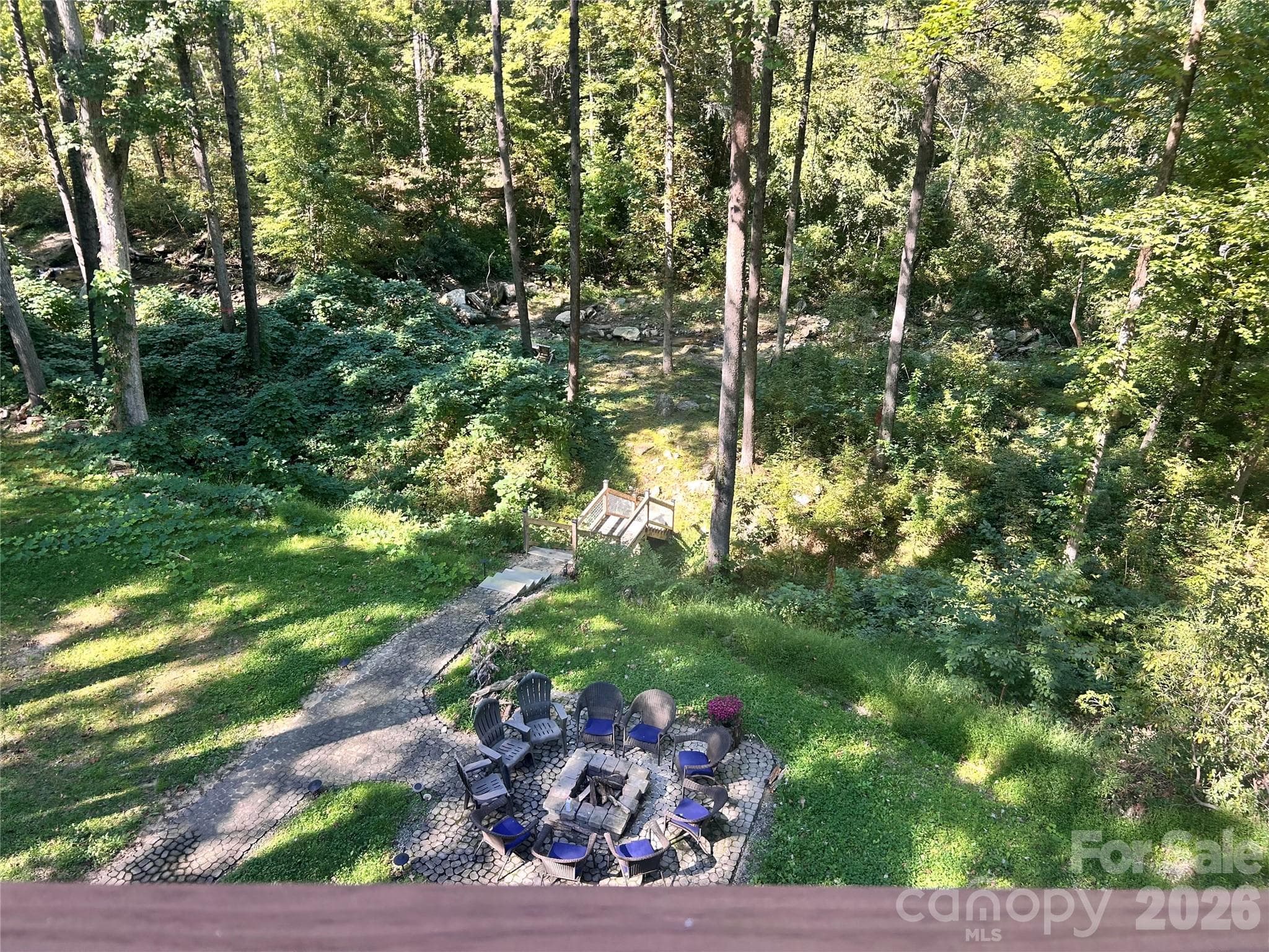 Top deck looking down to fire pit and creek - 127 Cattail Road, Lake Lure