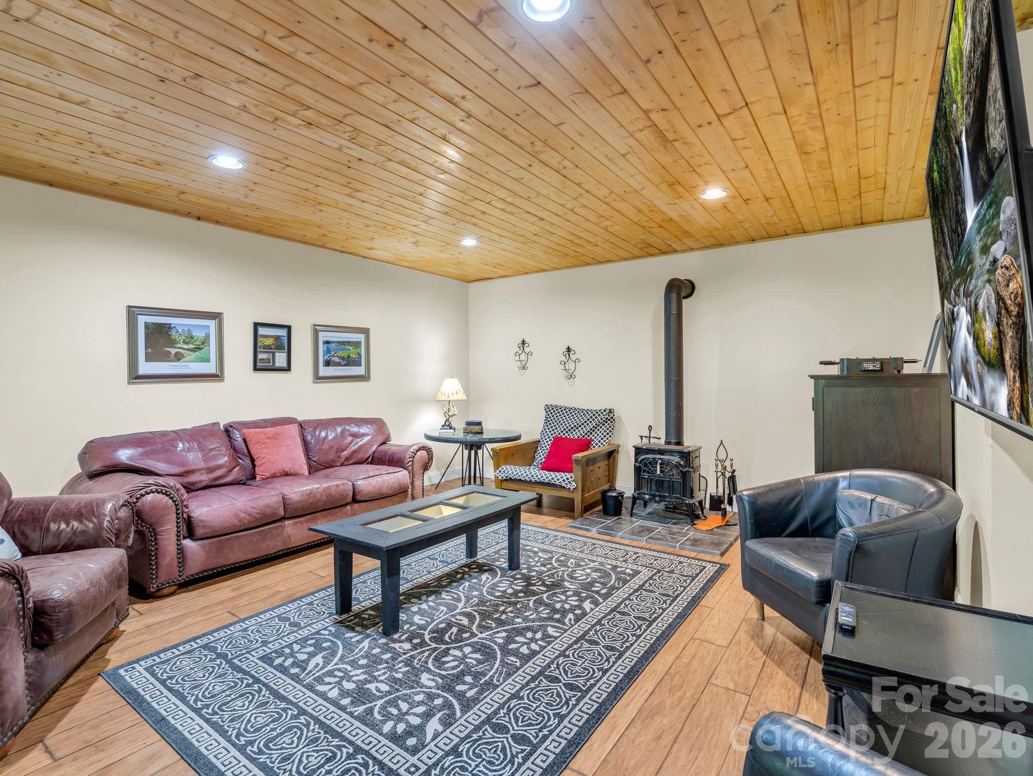 Game room living, wood stove - 127 Cattail Road, Lake Lure