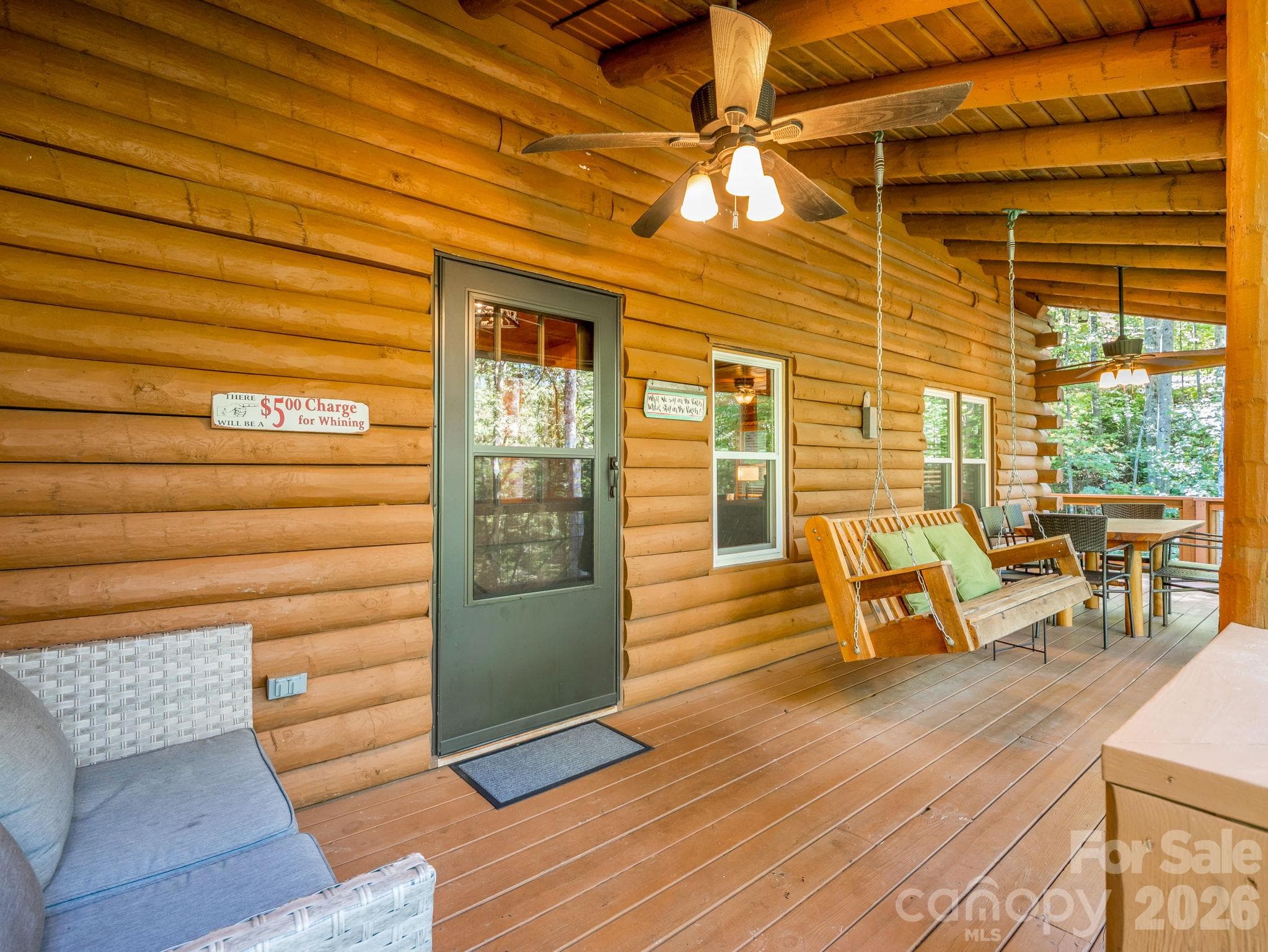 Back deck with swing and seating - 127 Cattail Road, Lake Lure