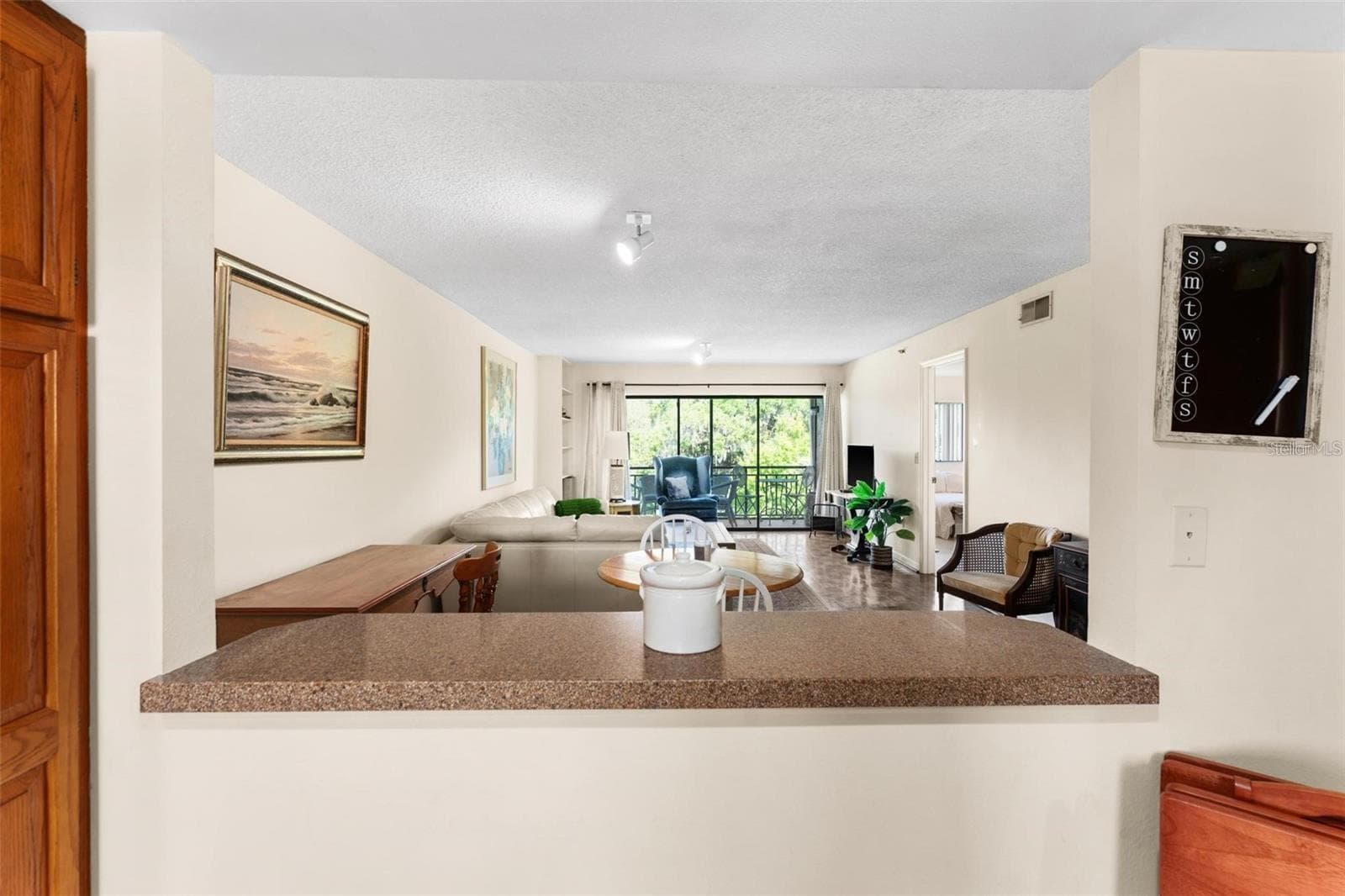 Eat-in Kitchen and Breakfast Bar over looking Living Room - 1162 CARMEL CIR #440, CASSELBERRY