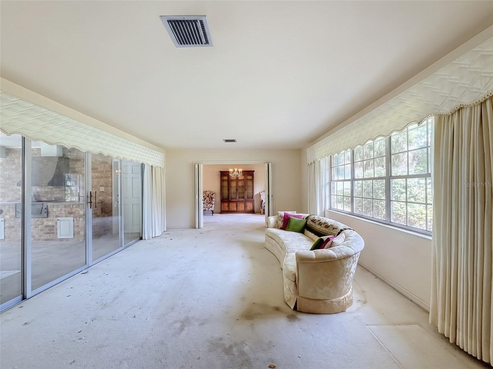 Living Room with Sliding Glass Doors to Pool - 8038 SPRING DR, YALAHA
