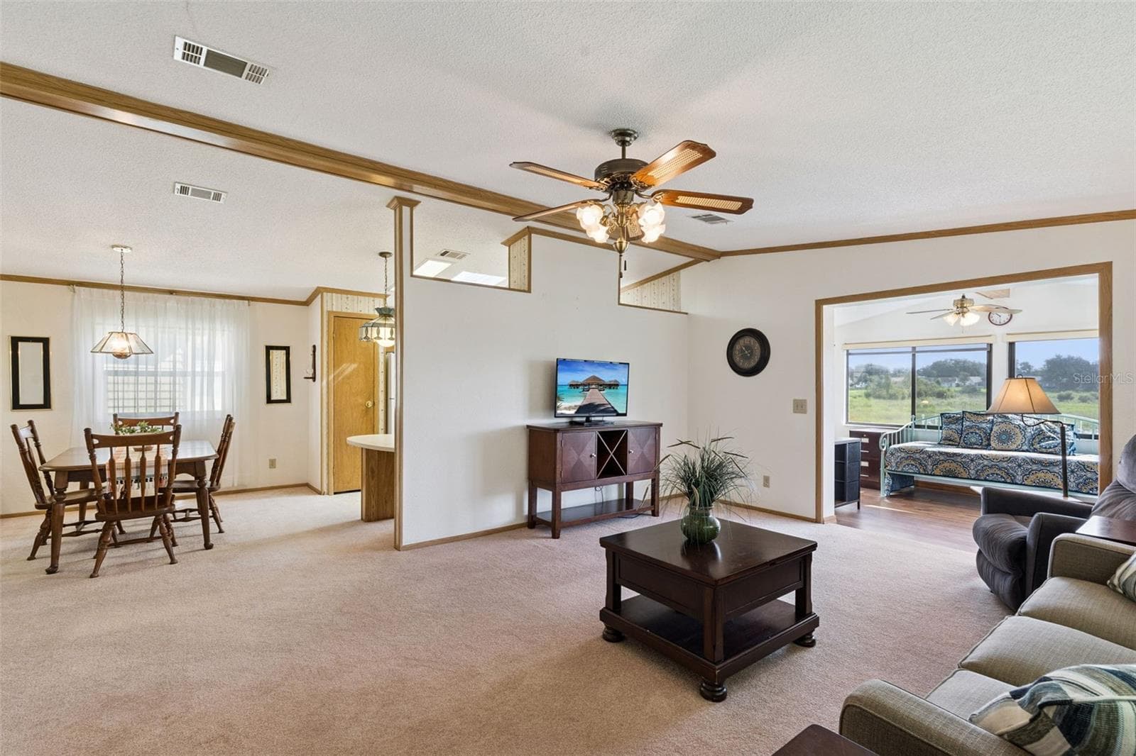 Open living area connecting the dining room and the sunroom - 25038 CLIFFORD HL, LEESBURG