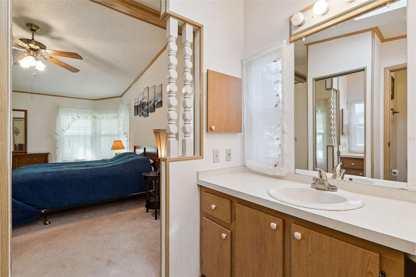 Primary bathroom vanity open to the primary bedroom - 25038 CLIFFORD HL, LEESBURG