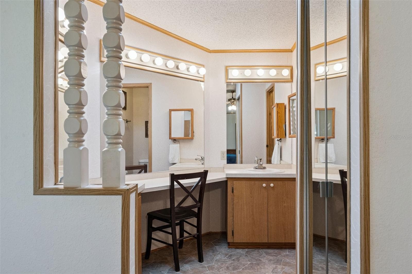 Primary bathroom vanity area with built-in makeup desk and walk-in shower - 25038 CLIFFORD HL, LEESBURG