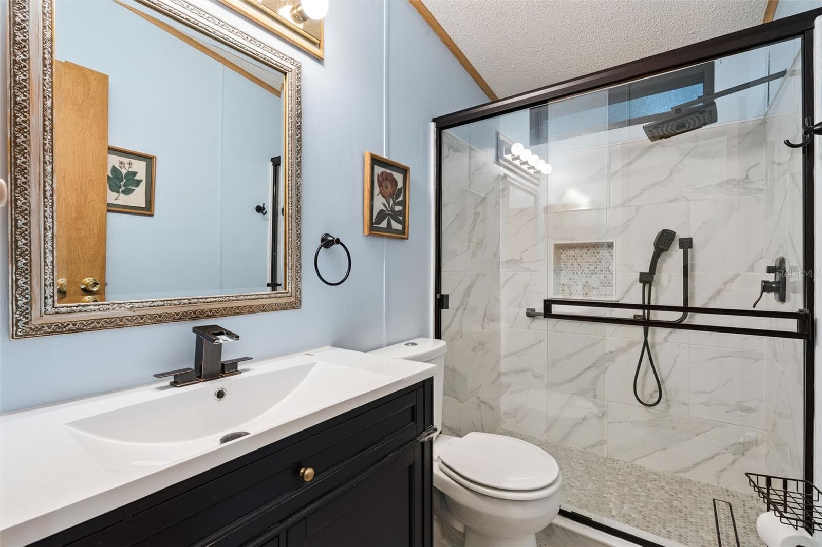 Updated guest bathroom with tiled walk-in shower, glass doors and new vanity - 25038 CLIFFORD HL, LEESBURG