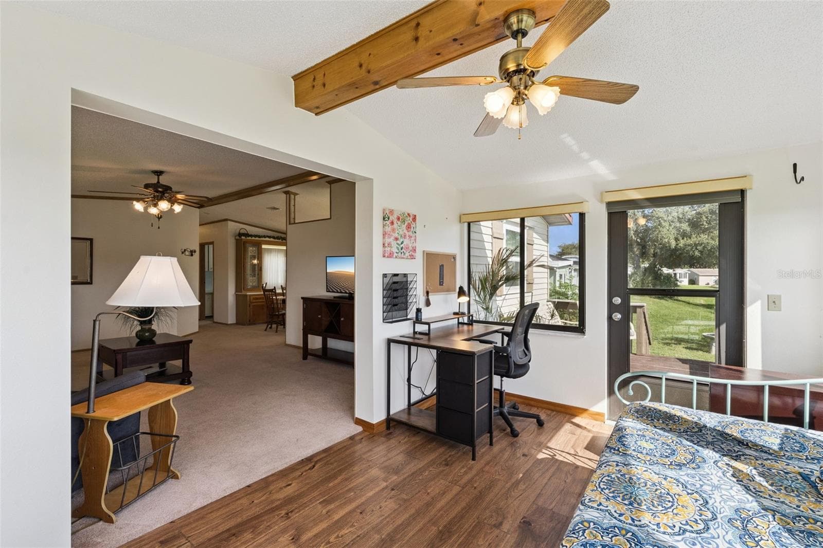 Sunroom with wood-look flooring, beamed ceiling and opening to the living room - 25038 CLIFFORD HL, LEESBURG