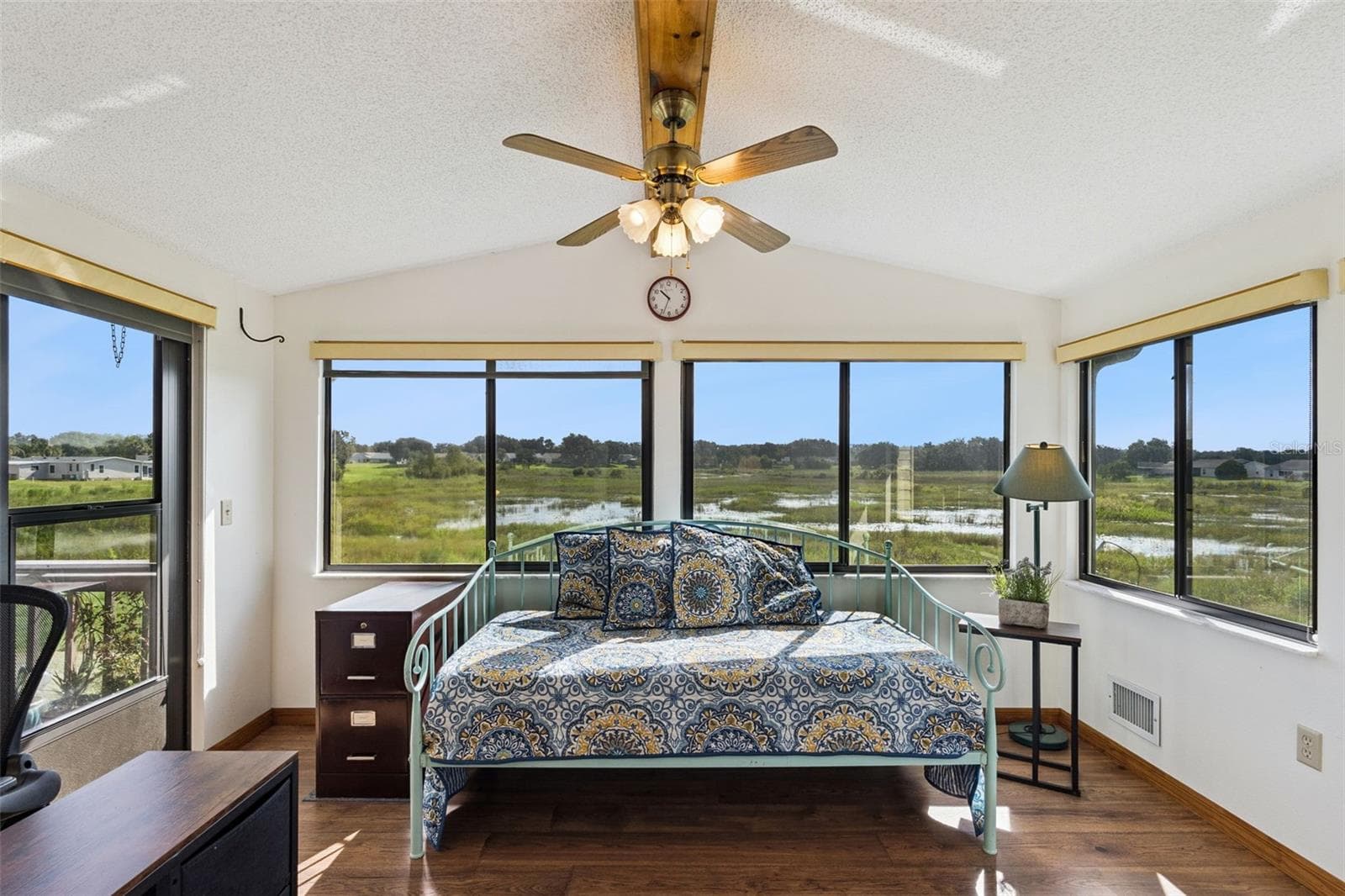 Sunroom with wide windows overlooking the open marsh - 25038 CLIFFORD HL, LEESBURG