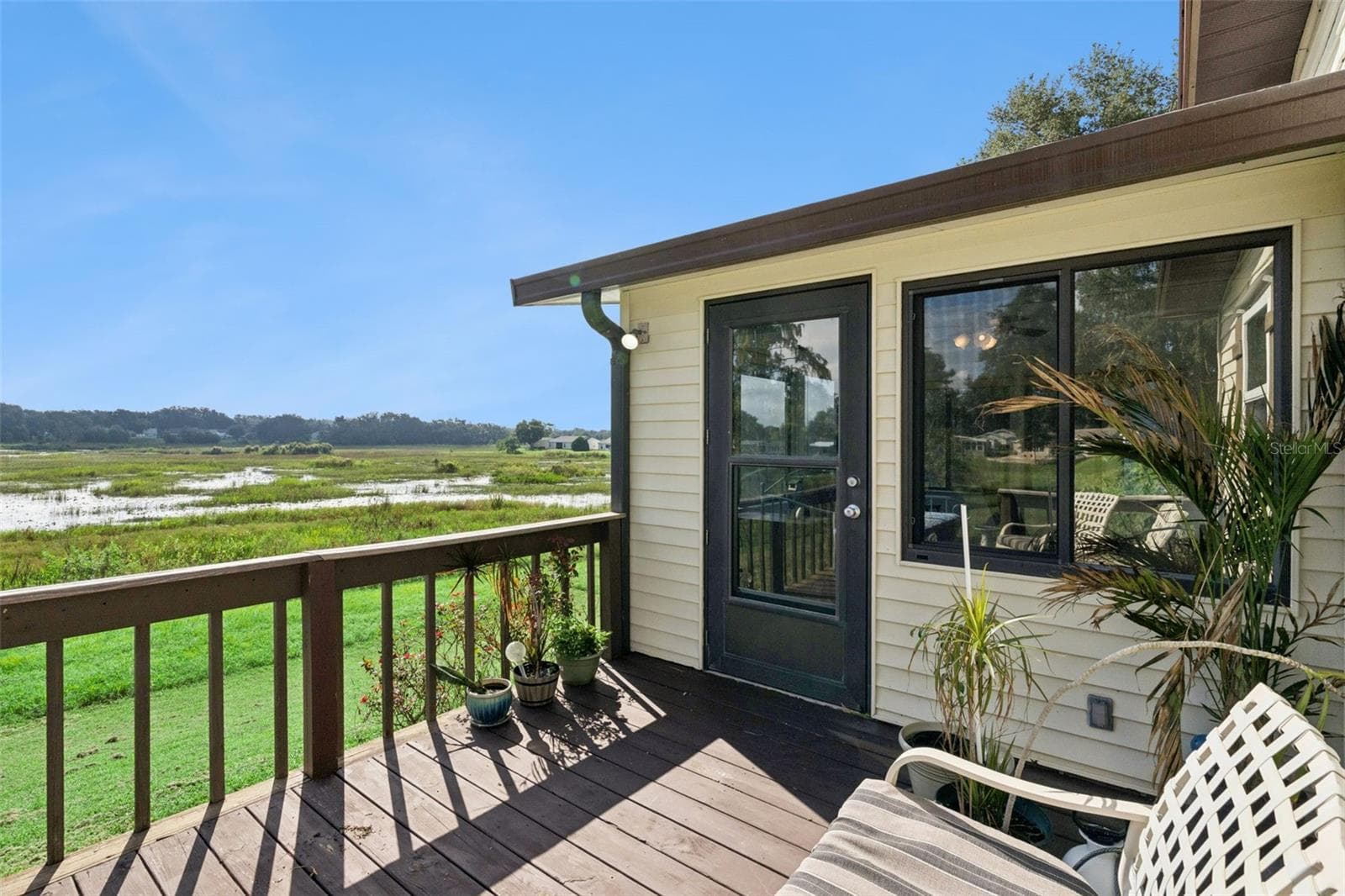 Rear deck off the sunroom overlooking the open marsh - 25038 CLIFFORD HL, LEESBURG