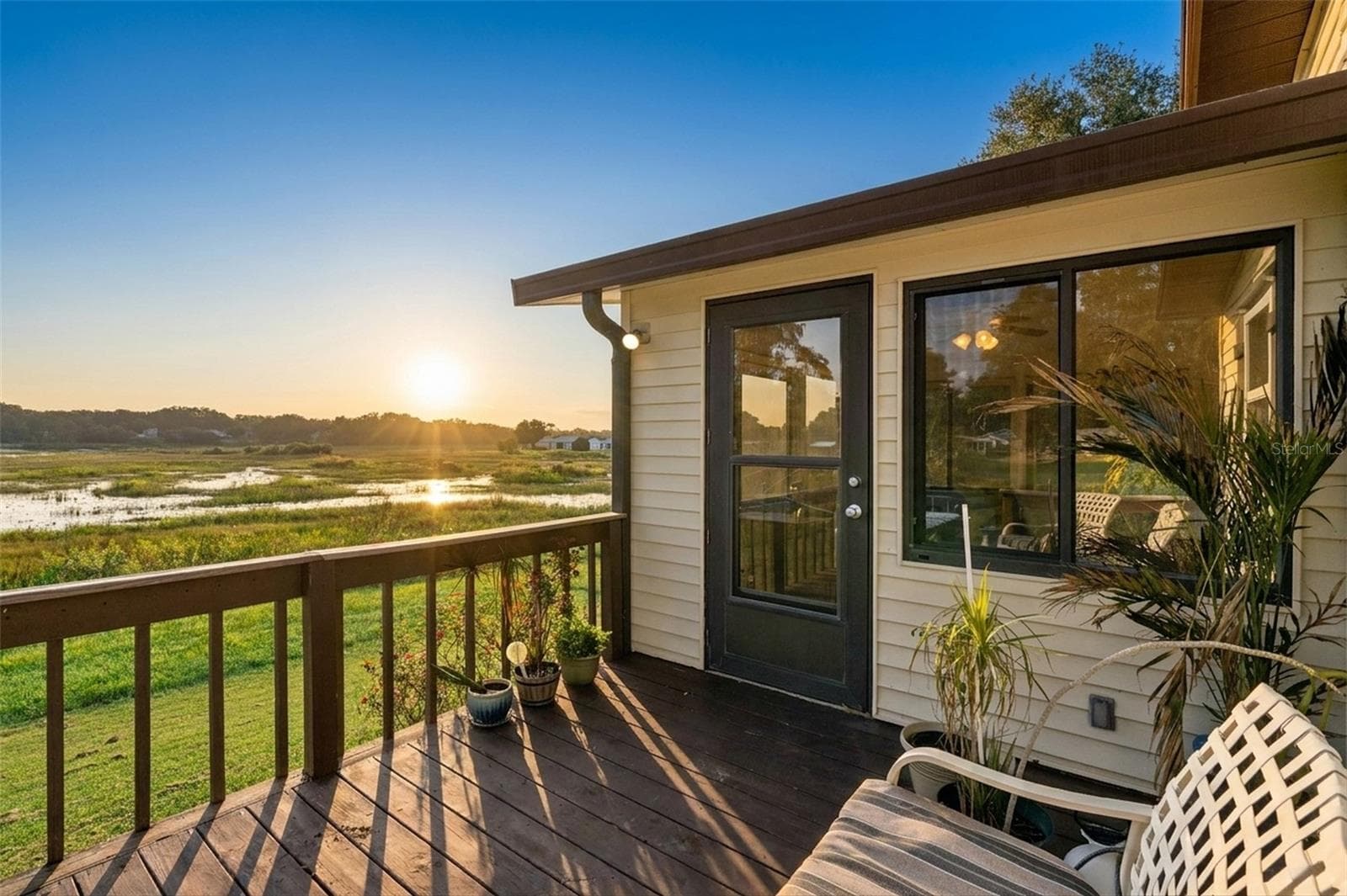 Digitally enhanced: sunrise view from the rear deck over the open marsh - 25038 CLIFFORD HL, LEESBURG