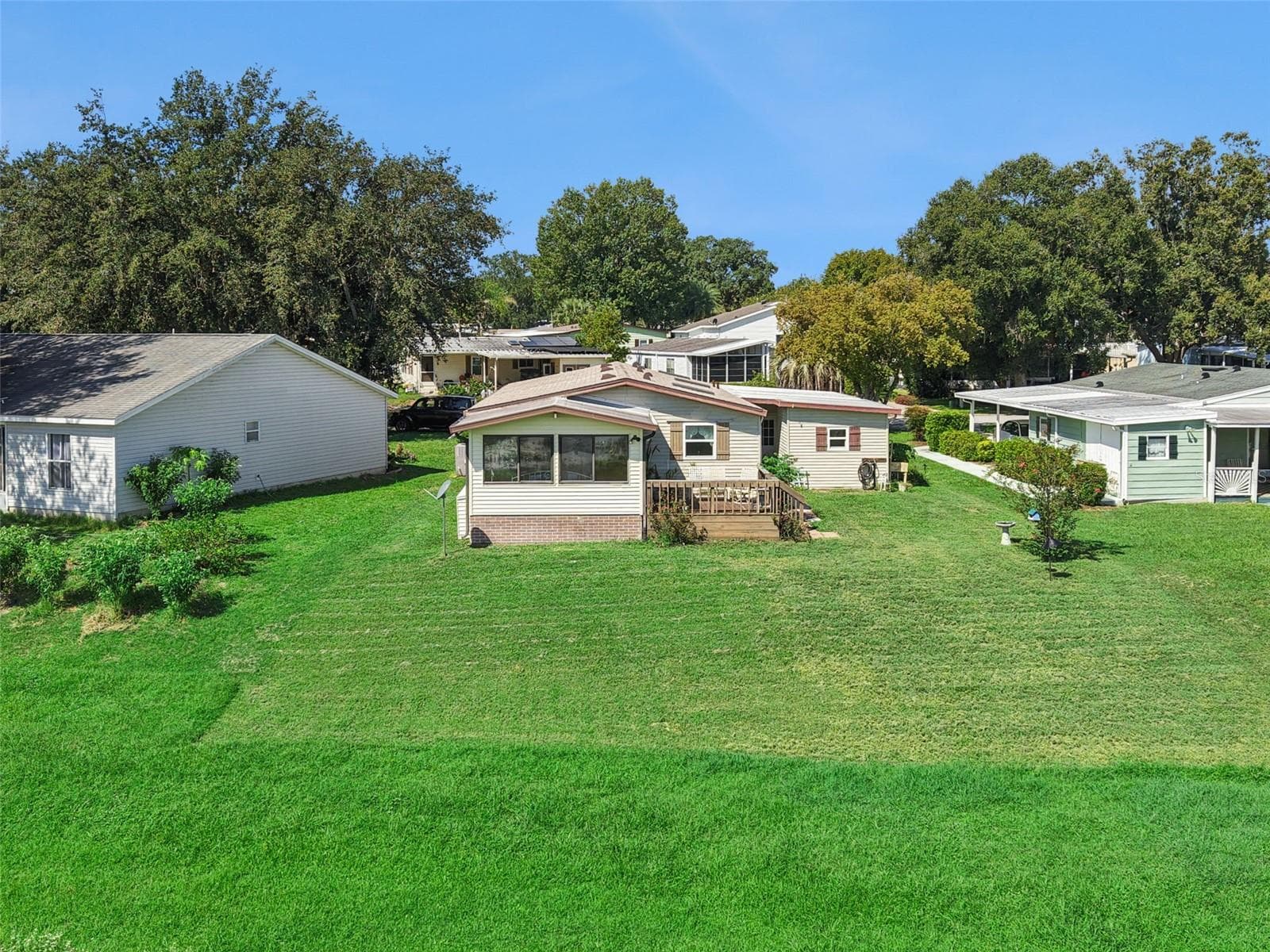 Aerial view of the rear of the home and backyard - 25038 CLIFFORD HL, LEESBURG