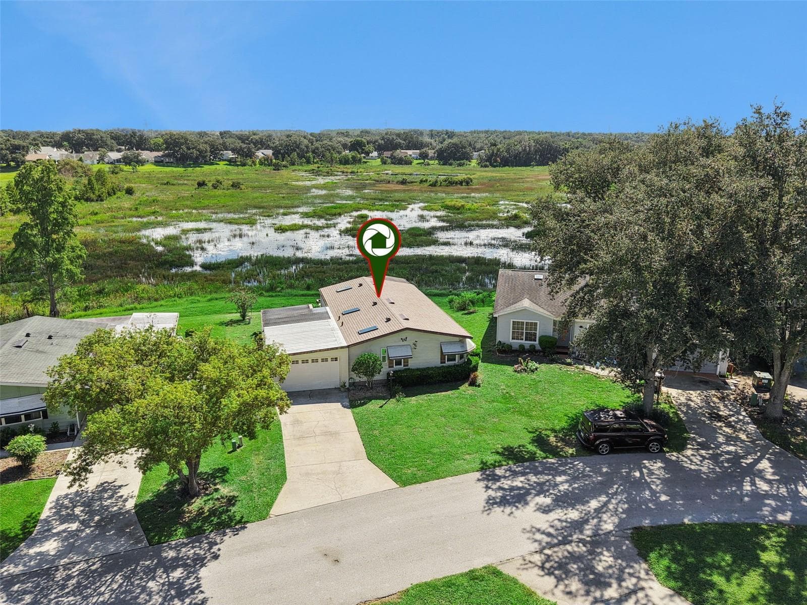 Aerial view with the home marked, backing to the open marsh - 25038 CLIFFORD HL, LEESBURG