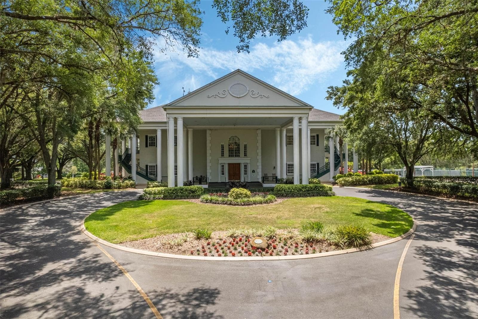 Community amenity: columned clubhouse with a circular drive - 25038 CLIFFORD HL, LEESBURG