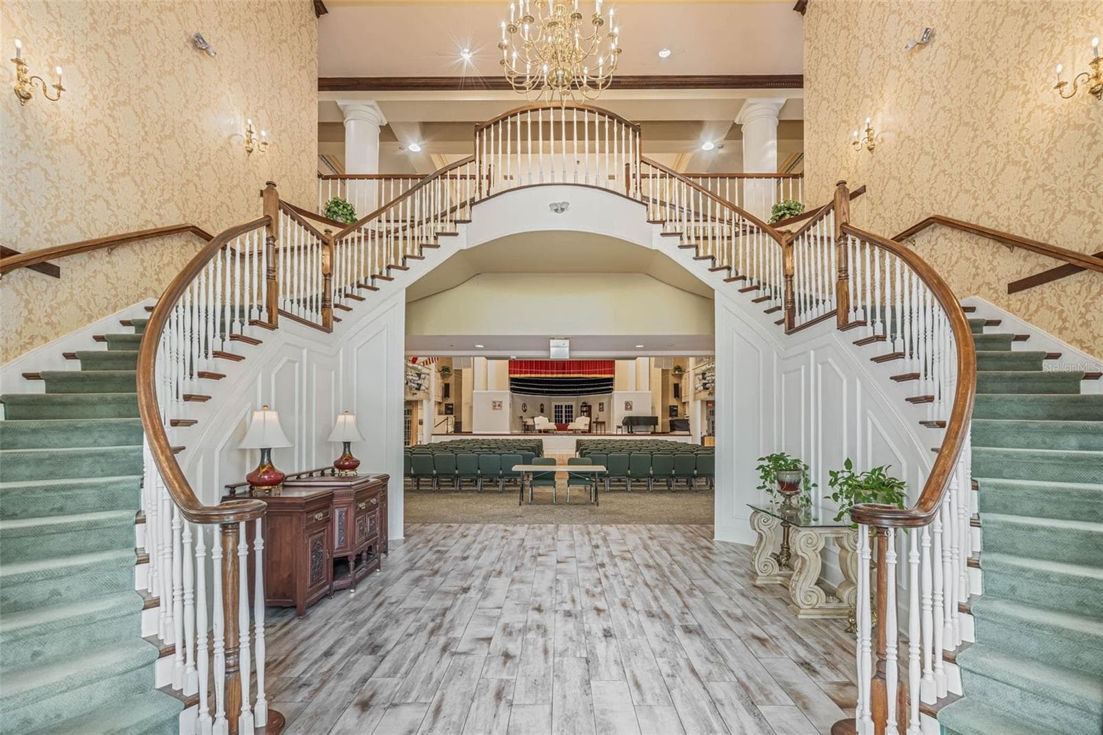 Community amenity: clubhouse foyer with double staircase and chandelier - 25038 CLIFFORD HL, LEESBURG