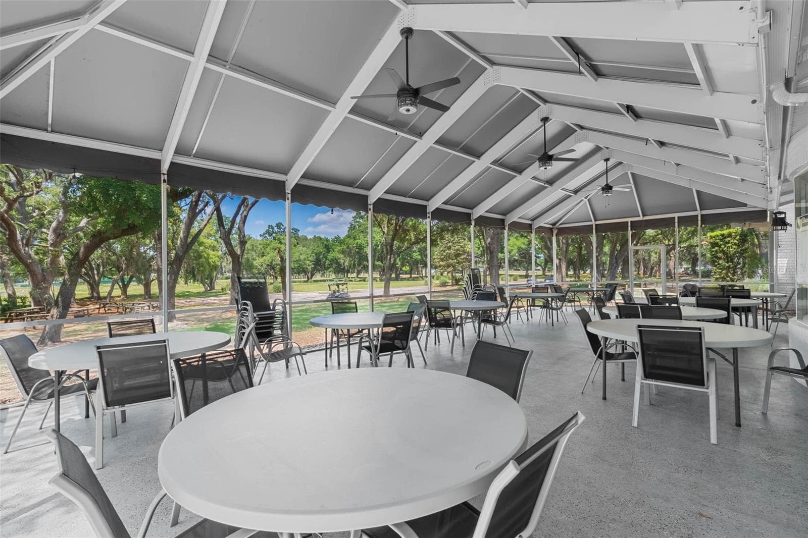 Community amenity: screened pavilion with tables and ceiling fans - 25038 CLIFFORD HL, LEESBURG