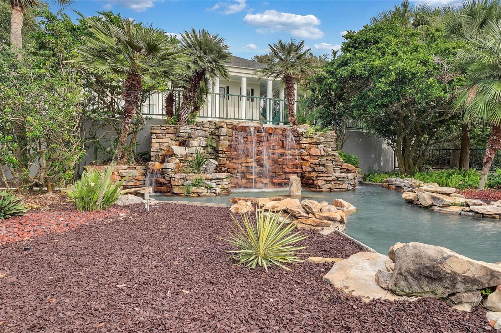Community amenity: rock waterfall feature at the pool - 25038 CLIFFORD HL, LEESBURG