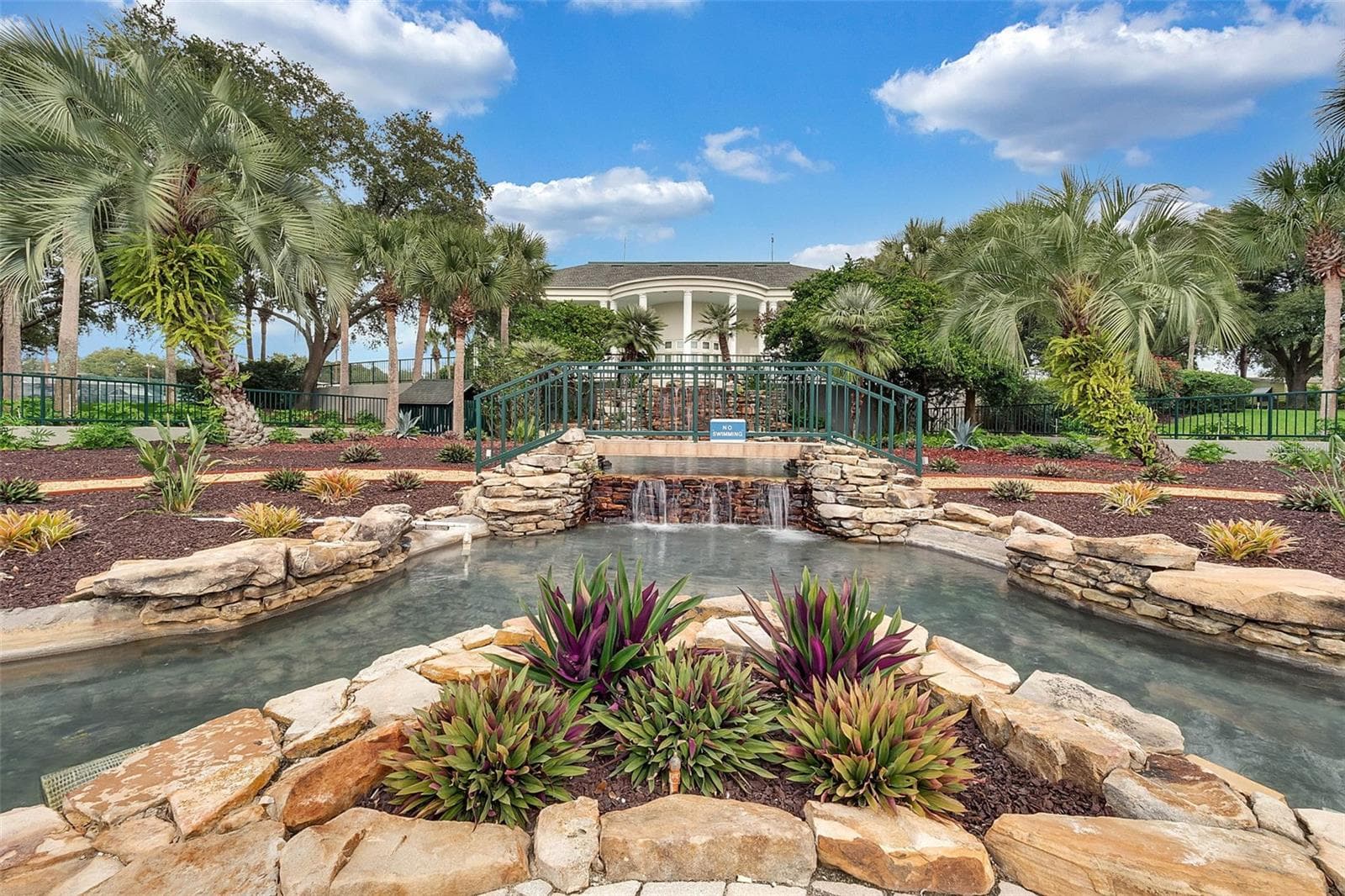 Community amenity: waterfall, landscaped garden and footbridge by the clubhouse - 25038 CLIFFORD HL, LEESBURG
