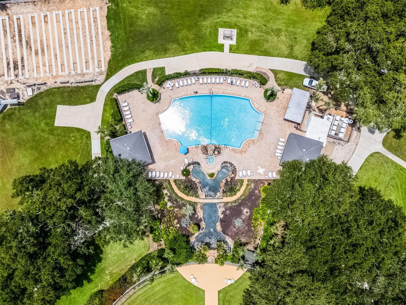 Community amenity: aerial view of the pool, waterfall and sun deck - 25038 CLIFFORD HL, LEESBURG
