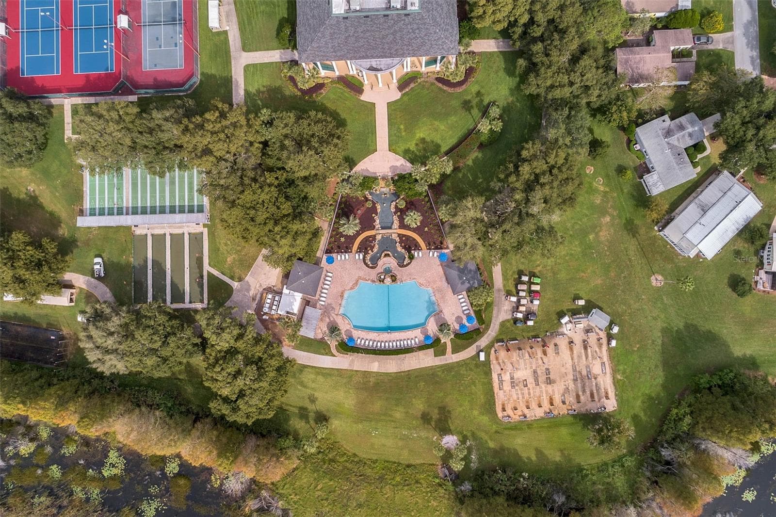 Community amenity: overhead view of the clubhouse, pool and game courts - 25038 CLIFFORD HL, LEESBURG